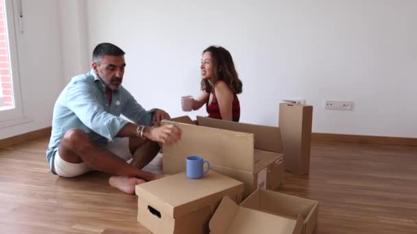 Happy Mature Couple Floor Moving Boxes — Stok Video