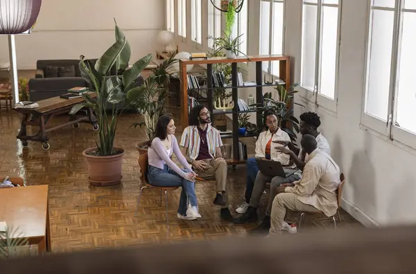group of diverse people meeting in a therapy center for group talks, alcoholics anonymous