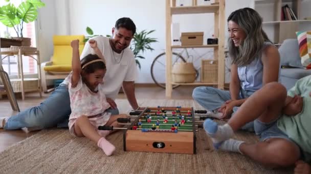 Light Hearted Moment Family Shares Laughter Playing Miniature Foosball Game — Stock Video