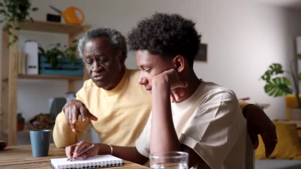 Thoughtful Elder Explaining Schoolwork His Pensive Grandson Sharing Wisdom Study — Stock Video