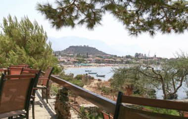 View of Stoupa town and beach at sunset, located in Messinia, Mani, Greece. 