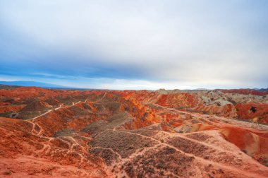 visiting the Zhangye park and seeing the Dan xia landform clipart