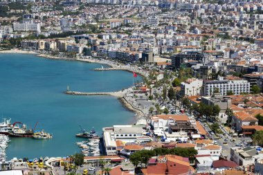 Aerial view of Kusadasi, Aydin Province, Turkey with blue sea,Turkish Flag and buildings