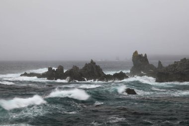 A rocky shoreline on the Atlantic Ocean  in The Dungeon Provincial Park, Bonavista Peninsula Newfoundland and Labrador, Canada. clipart