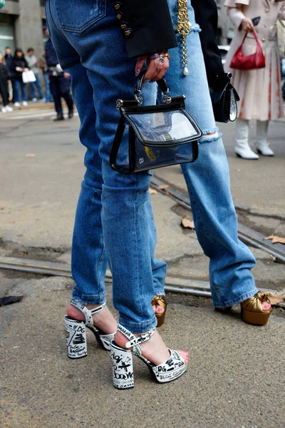 Stock image Bags, shoes, boots and legs during Dolce & Gabbana Fashion Show