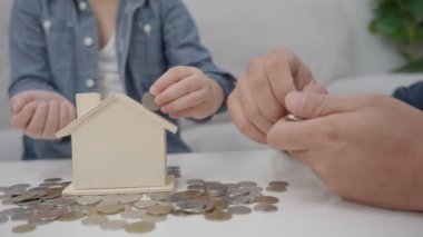 Save money. children putting coin for saving. wealth, Finance, insurance, investment, education, future, plan life, learn, banking, family, health, health and accident insurance.