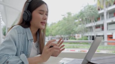 Beautiful Asian woman female student meeting team for work project. Smile girl happy study online. book in college campus. Portrait female on international Asia University. Education, study, school