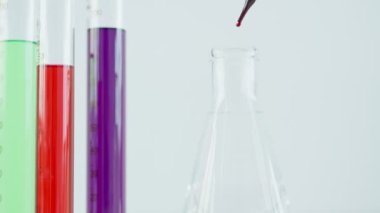 Scientist analyze biochemical samples in advanced scientific laboratory. Medical professional use dropper mix microbiological developmental of viral. Biotechnology research in  science lab. cosmetic