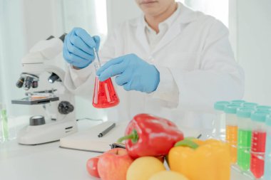 Scientist check chemical food residues in laboratory. Control experts inspect the concentration of chemical residues. hazards, ROHs standard, find prohibited substances, contaminate, Microbiologist