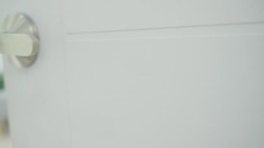 Moving house, relocation. The key was inserted into the door of the new house, inside the room was a cardboard box containing personal belongings and furniture. move in the apartment or condominium