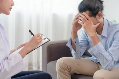man with mental health problems is consulting. psychiatrist is recording the patient's condition for treatment. encouragement, love and family problem, bipolar , depression patient, protect suicide