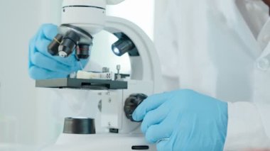 Scientist check chemical food residues in laboratory. Control experts inspect quality of fruits, vegetables. lab, hazards, ROHs, find prohibited substances, contaminate, Microscope, Microbiologist