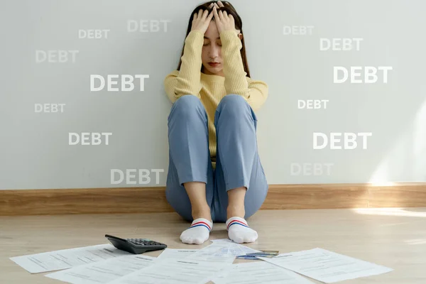 Stressed and headache asian woman with large bills or invoices no money to pay to expenses and credit card debt. shortage, Financial problems, mortgage, loan, bankruptcy, bankrupt, poor, empty wallet