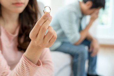 Divorce. Woman remove married ring. Couples desperate and disappointed after marriage. Husband wife sad, upset and frustrated after quarrels conflict. distrust, love problems, betrayals, family, lover