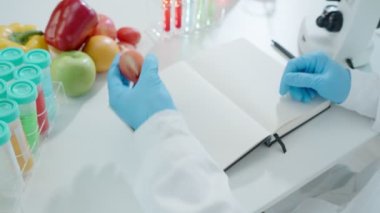 Scientist check chemical food residues in laboratory. Control experts inspect quality of fruits, vegetables. lab, hazards, ROHs, find prohibited substances, contaminate, Microscope, Microbiologist
