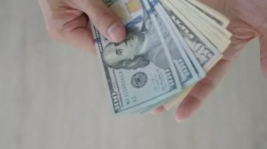 USD currency , Many dollar bank notes Placed on the table.The  Dollar is the currency of USA that is used to change, buy, sell, accumulate, and invest in united kingdom's state people.