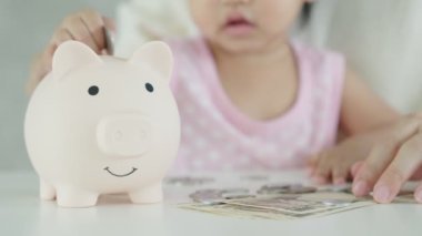 Save money. children putting coin for saving. wealth, Finance, insurance, investment, education, future, plan life, learn, banking, family, health, health and accident insurance.