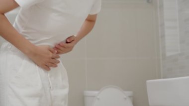 Constipation and diarrhea in bathroom. Hurt woman touch belly  stomach ache painful. colon inflammation problem, toxic food, abdominal pain, abdomen, constipated in toilet, stomachache, Hygiene
