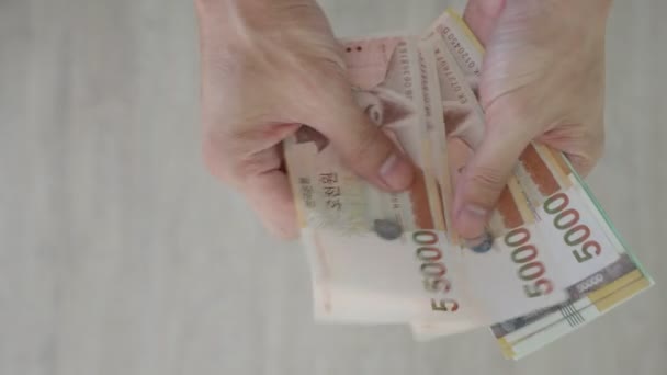 韩国的货币用来表示交换价值 韩元是韩国人民的主要货币 韩文赢得了货币换概念背景的笔记 — 图库视频影像