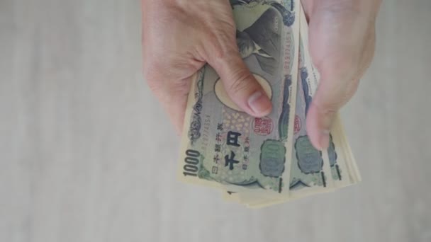 Японские Иены Закрыть Рукой Японскую Иену Валюта Японии Используемая Изменения — стоковое видео