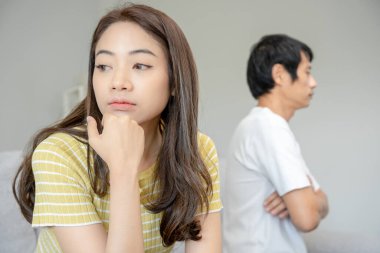Divorce. Asian couples are desperate and disappointed after marriage. Husband and wife are sad, upset and frustrated after quarrels. distrust, love problems, betrayals. family problem, teenage lov