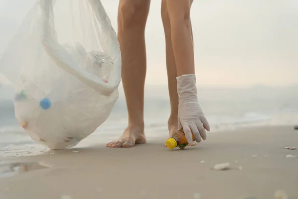 Save water. Volunteer pick up trash garbage at the beach and plastic bottles are difficult decompose prevent harm aquatic life. Earth, Environment, Greening planet, reduce global warming, Save world