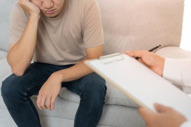 man with mental health problems is consulting. psychiatrist is recording the patient's condition for treatment. encouragement, love and family problem, bipolar , depression patient, protect suicide