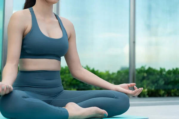 woman practicing meditate on the balcony. Asian woman do exercises in morning. balance, recreation, relaxation, calm, good health, happy, relax, healthy lifestyle, reduce stress, peaceful, Attitude.