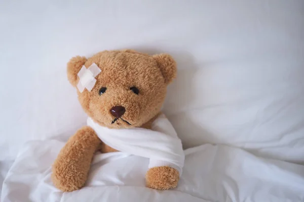 bear with bandage, child medical care . injured child teddy bear and painful in hospital, fell ill in the bed, accident, insurance, health care, risk, loss, emergency, protection, treat, kid , bab