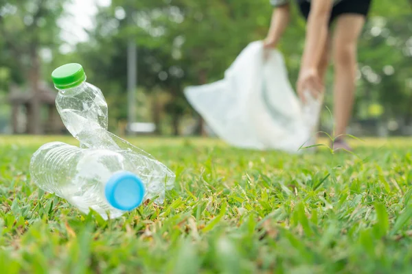 Save earth. Volunteer pick up trash garbage at the park and plastic bottles are difficult decompose prevent harm. Earth, Environment, Greening planet, reduce global warming, Save world ,pollution