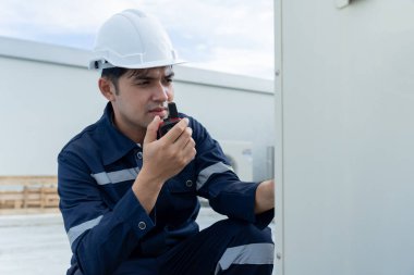 Mechanic or maintenance or electrical engineer checking main electrical control systems industrial plant. Utility fore man daily check power systems in process. Main Distribution Board, Switchboards