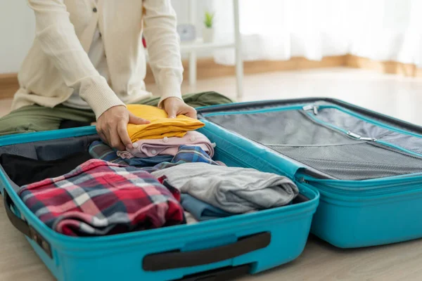 stock image Travel bag. female are checking the detail and quantity of items used during the trip. Young women are prepare clothes and personal belongings. Pack your luggage before travel.