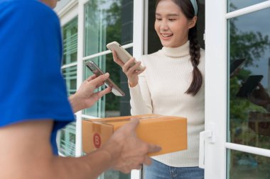 Happy smile Asian woman scan QR code for pay of food. Delivery man send deliver express. online shop, paper container, takeaway, postman, delivery service, packages, electronic money, Digital transfe