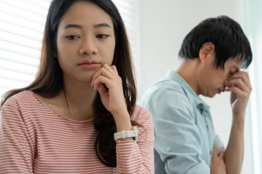 Divorce. Asian couples are desperate and disappointed after marriage. Husband and wife are sad, upset and frustrated after quarrels. distrust, love problems, betrayals. family problem, teenage lov