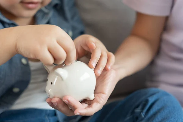 Save money. children putting coin for saving. wealth, Finance, insurance, investment, education, future, plan life, learn, banking, family, health, health and accident insurance