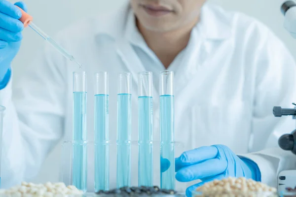 stock image Scientist analyze biochemical samples in advanced scientific laboratory. Medical professional use dropper mix microbiological developmental of viral. Biotechnology research in  science lab. cosmetic