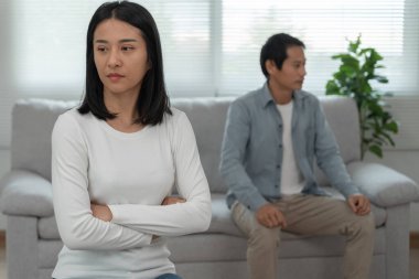 Divorce. Asian couples are desperate and disappointed after marriage. Husband and wife are sad, upset and frustrated after quarrels. distrust, love problems, betrayals. family problem, teenage lov
