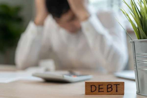 stock image Stressed and headache man with large bills or invoices no money to pay to expenses and credit card debt. shortage, Financial problem, bankruptcy, mortgage, loan, bankrupt, poor, empty wallet