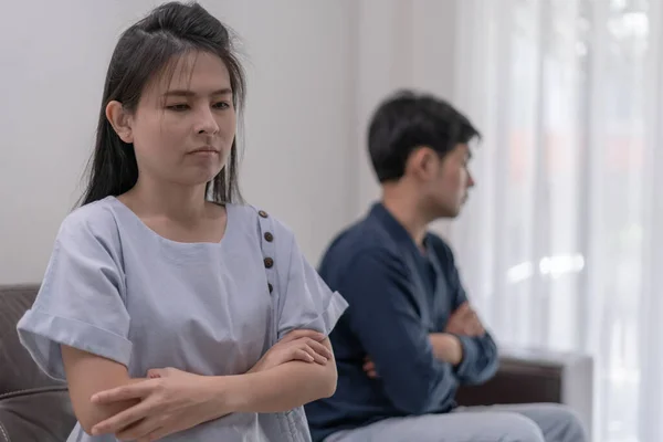 stock image Divorce. Asian couples are desperate and disappointed after marriage. Husband and wife are sad, upset and frustrated after quarrels. distrust, love problems, betrayals. family problem, teenage love