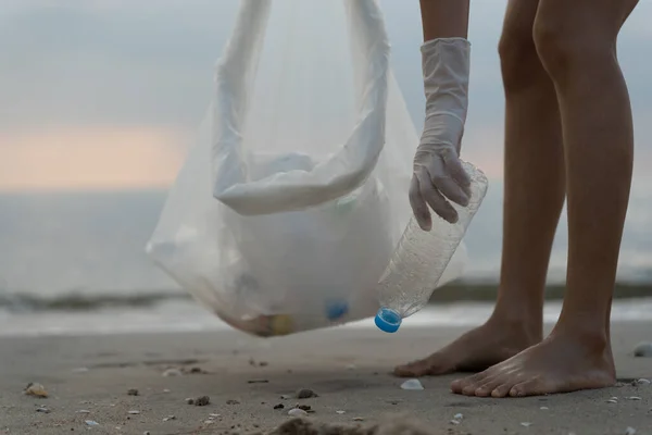 Save ocean. Volunteer pick up trash garbage at the beach and plastic bottles are difficult decompose prevent harm aquatic life. Earth, Environment, Greening planet, reduce global warming, Save world