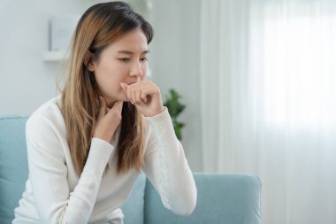 sick woman with a headache sitting under blanket, female sneezing and runny nose with seasonal influenza, allergic, high fever and influenza, resting, virus, coronavirus, feel illness, respiratory