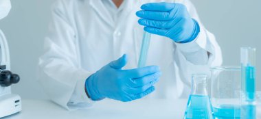 Scientist analyze biochemical sample in advanced scientific laboratory. Medical professional check chemical mix microbiological developmental of viral. Biotechnology research in science lab. cosmetic