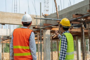 Engineers use blueprint check construction on site. Contractor and inspector inspection construction during project.civil Forman check quality assurance. Audit, inspect, quality control.