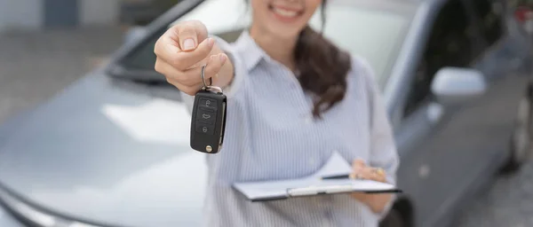 stock image lease, rental car, sell, buy. Dealership manager send car keys to the new owner.  Sales, loan credit financial, rent vehicle, insurance,  renting, Seller, dealer, installment, car care business