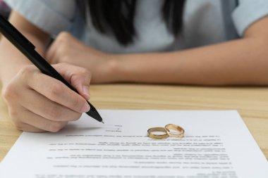 Divorce. Woman remove married ring. Couples desperate and disappointed after marriage. Husband wife sad, upset and frustrated after quarrels conflict. distrust, love problems, betrayals, family, lover