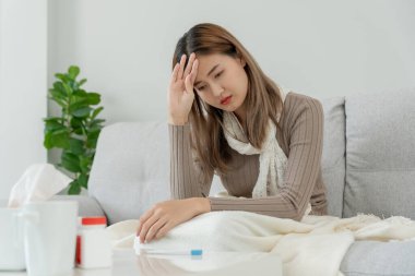 sick woman with a headache and feeling cold on sofa, female sneezing and runny nose with seasonal influenza, allergic, high fever and influenza, resting, virus, coronavirus, feel illness, respiratory