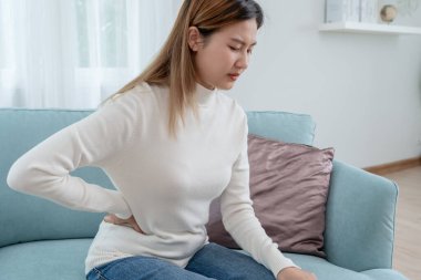 stomach ache. Asian women have abdominal pain, indigestion, gastritis, menstrual cramps, flatulence, diarrhea, distention, colon cancer, belly inflammation problem, suffer food poisoning, abdomen