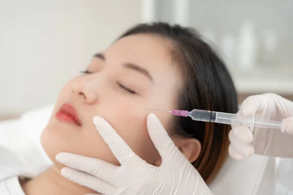 Cosmetic surgery, skin whitening injection, filler injection, HA Skin Booster, Botox, beautiful Asian girls receive beauty treatments at beauty clinic, skincare, pore rejuvenation, wrinkle, baby face