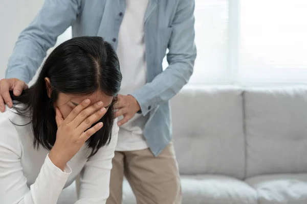 Couple support each while discussing family issues with psychiatrist. Husband encourages and empathy husband suffers depression. psychological, divorce, trust, care, workplace and health issues