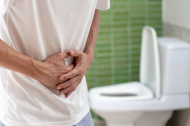 Constipation and diarrhea in bathroom. Hurt man touch belly  stomach ache painful. colon inflammation problem, toxic food, abdominal pain, abdomen, constipated in toilet, stomachache, Hygiene